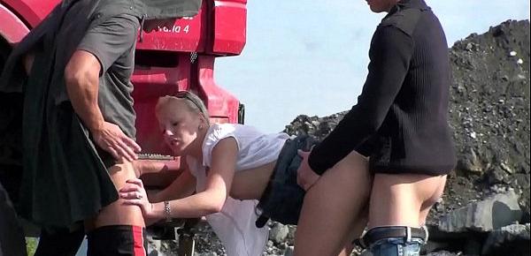  A very cute blonde young lady is fucked in public threesome at a construction site